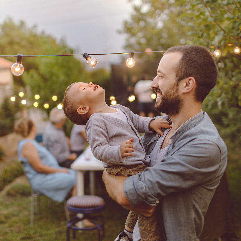 Father and son at a backyard party